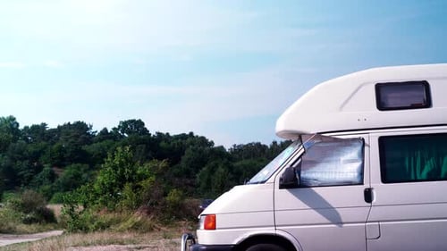 White Camper Van Parked near Forest