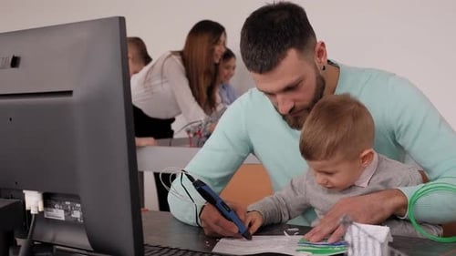 Man and Child use 3D Printing Pen