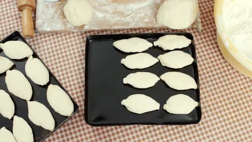 Preparing Dough Pockets on Baking Sheets in Home