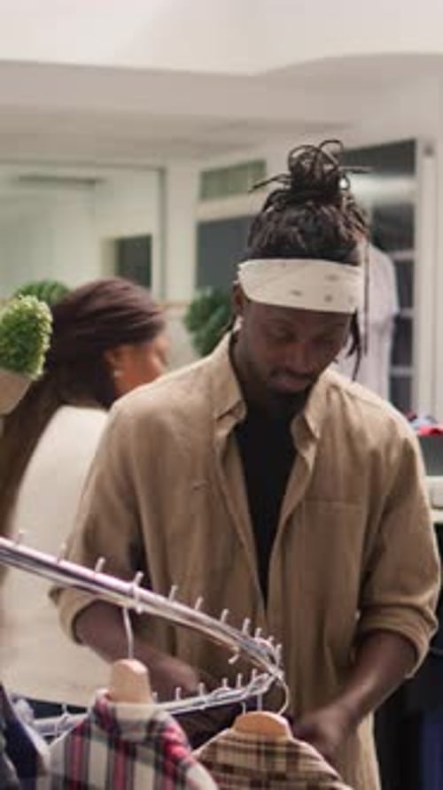 Vertical Video Trendy Shopper in Stylish Clothing Store