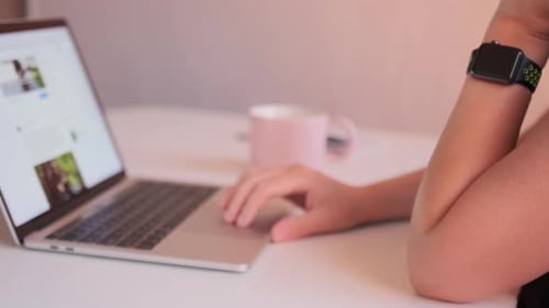 Young woman work study from home using keyboard of computer communicate in online chat
