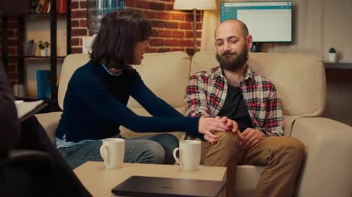 Loving Couple Holding Hands During Therapy Session