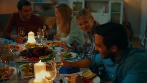 Family and Friends Enjoying Festive Dinner Together Indoors