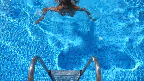 Attractive Tanned Woman in Swimsuit Getting Out of Pool Young Sexy Girl Enjoying Summer Vacation