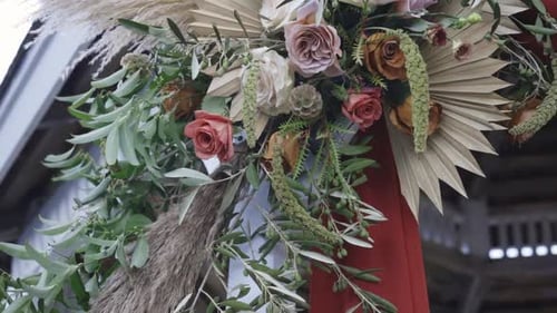 Wedding Arch Decorated with Roses and Pampas Grass