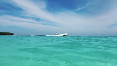 Fisherman Sails On A White Boat On The Ocean. Boat And Blue Ocean