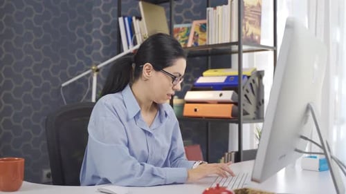 Skilled business woman works in the office.