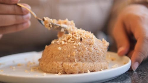 Cake With Nuts Being Eaten Up Close