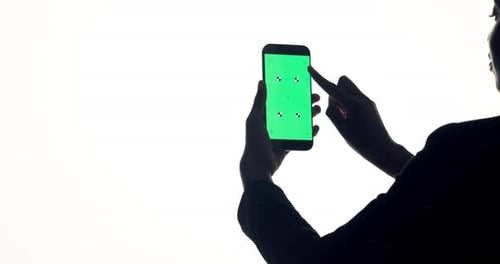 Green screen, phone and person in studio scroll for business website, online info and internet