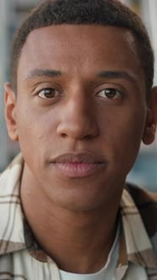 Thoughtful African American Man Student Turn Head Looking at Camera Library Ethnic Male Guy Portrait