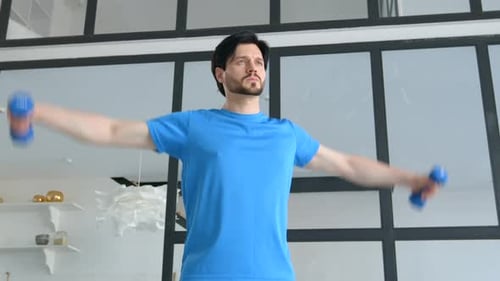 Man Exercises Indoors with Dumbbells for Health and Fitness