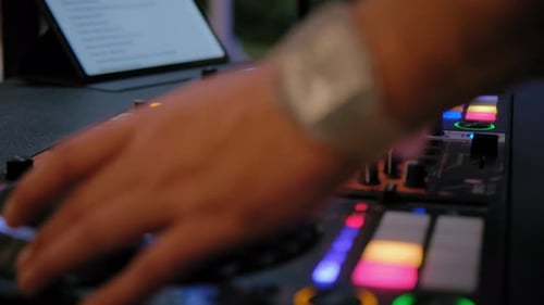 Close Up Shot of DJ Sound Mixer at Night Event