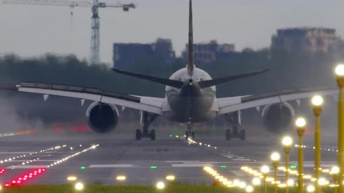 Airplane Taxiing on Runway After Landing