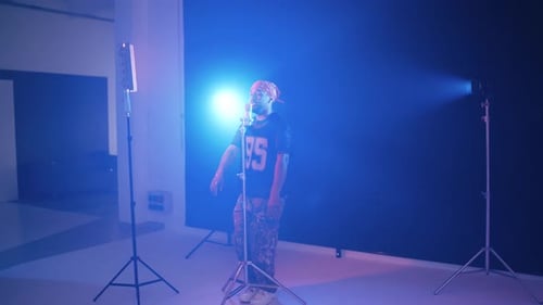 Reggaeton Singer Performing Song in Music Video Studio