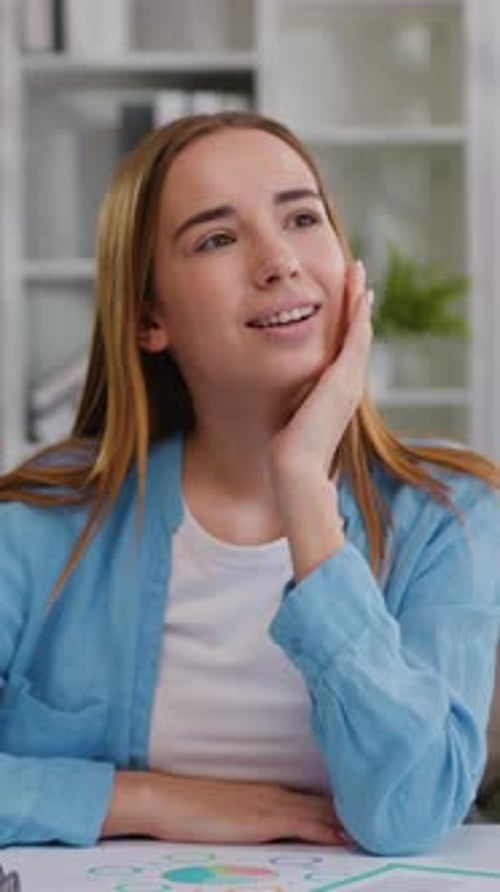 Dreamy Smiling Young Girl Studying Online From Home on Laptop and Thinking or Day Dreaming with