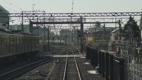 Rear View Shot Inside A Moving Train In Tokyo, Japan In Slow Motion - POV - wide shot