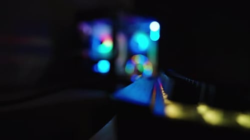 Illuminated Computer Tower Glowing in the Dark