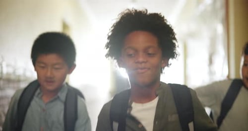 Education, school and kids running in hallway together as student friends for learning or recess
