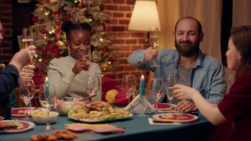 Friends Celebrate Christmas with Festive Dinner and Champagne