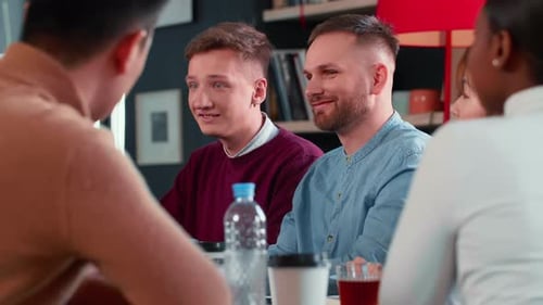 Modern Office Meeting Two Happy Young Caucasian Workplace Colleagues Discuss Ideas at Multiethnic