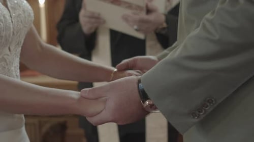 Bride and Groom Holding Hands at Wedding Ceremony