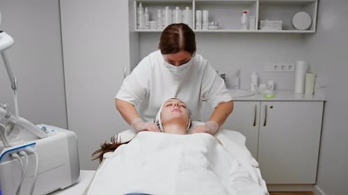 face skin facial rejuvenation cosmetic procedure Woman patient in cosmetology clinic doctor