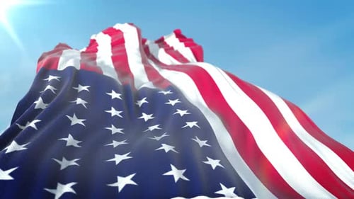 Realistic American Flag Waving in Slow Motion Against Blue Sky