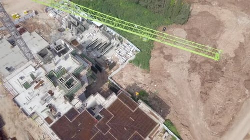 Large residential construction site with cranes, Aerial view