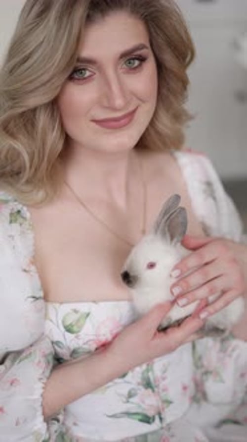 Woman Holds White Rabbit
