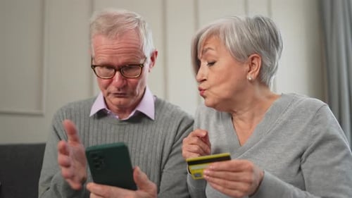 Senior Couple Man Woman Shopping Online with Smartphone Paying with Credit Card Old People Buying on