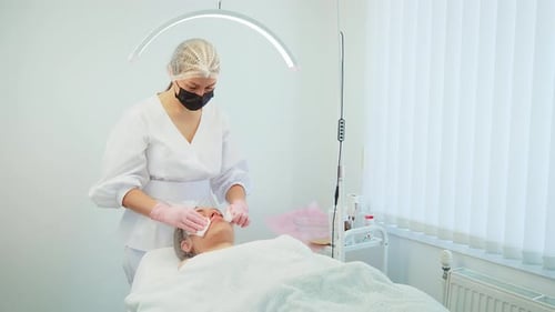 Anti Wrinkles Treatment Performed in Modern Cosmetology Clinic By Professional in Protective Gear