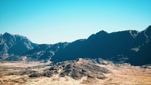 Expansive Arid Mountain Terrain Bathed in Warm Golden Sunlight