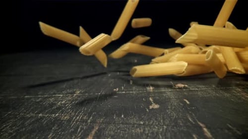 Dry Pasta Falls on the Table Filmed on a Highspeed Camera at 1000 Fps