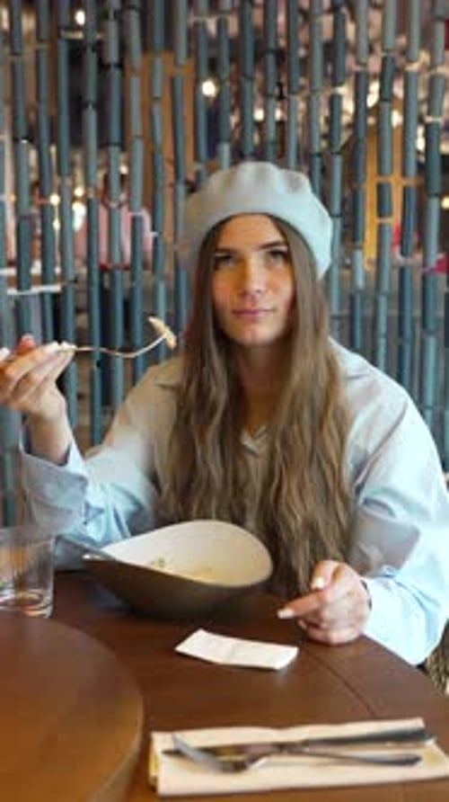 Woman Eating Pasta Restaurant Engaged Conversation Casual Dining Experience Vertical Video