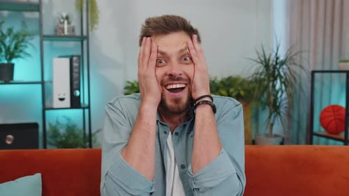 Man Smiling with Surprise Inside Home