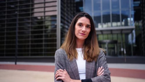 Business Woman Posing Confidently Outside Modern Office Building