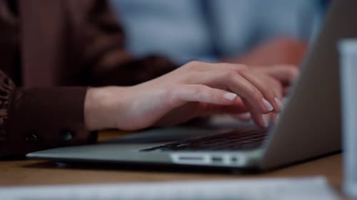 Woman Hands Typing on Laptop Keyboard Close Up