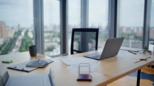 Empty Corporate Workspace Laptop in Office with City View Workplace Interior