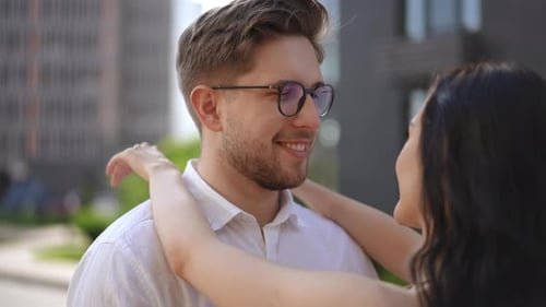 Romantic Couple Embracing Affectionately in City Setting