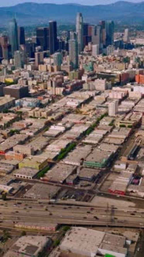 Aerial view of american city. Los Angeles downtown drone shot. Vertical video