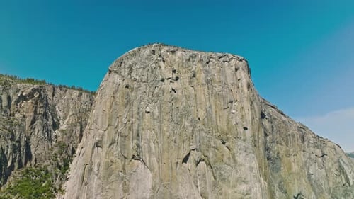 View of Yosemite Valley with evergreen forests visible in the background