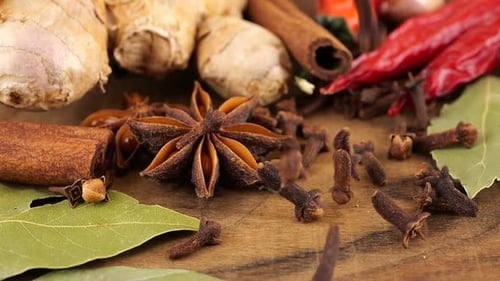 Assorted Cooking Spices on Rustic Wooden Surface