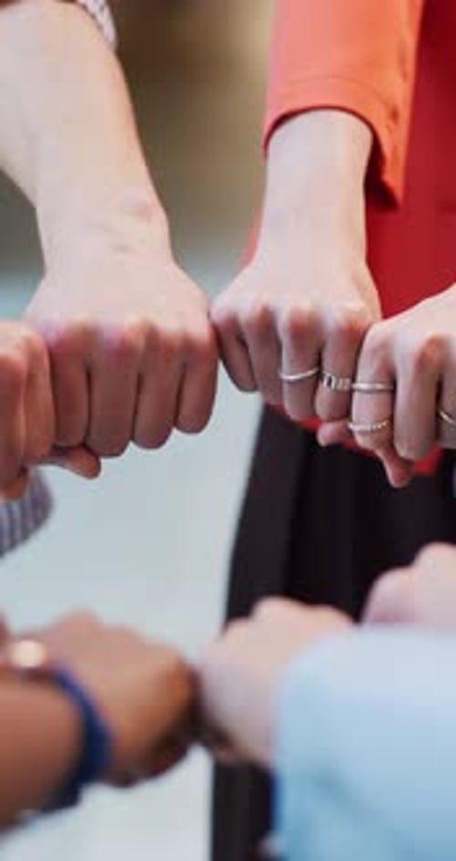 Fist, hands together and business people in circle for collaboration, partnership and teamwork