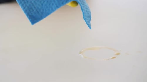 Cleaning a Spill on a White Surface