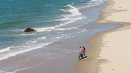 Couple Walking On Beach, Aerial Drone, Romantic Ocean Slow Motion