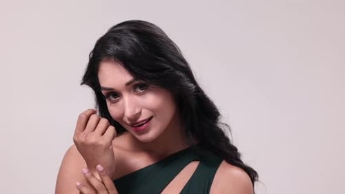 Glamorous Young Woman Posing in a Stylish Dress