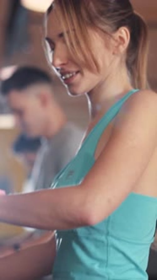 An Active Woman Engaging in a Variety of Exercises Within a Fitness Studio Environment