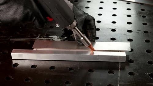 Skilled Welder Welding Metal Details Closeup View of Hands in Protective Gloves Labor on Plant