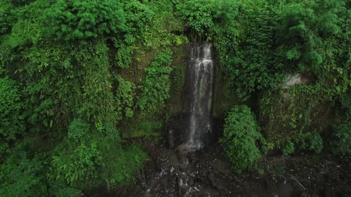 Secret and huge waterfall in Bali, Indonesia jungle