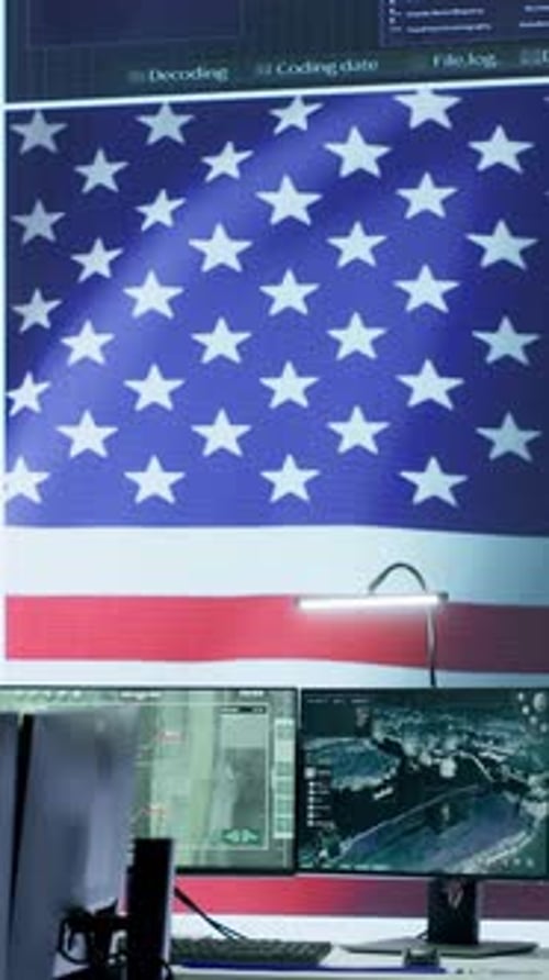 Salle de surveillance vidéo verticale vide avec un drapeau américain protégeant les informations classifiées